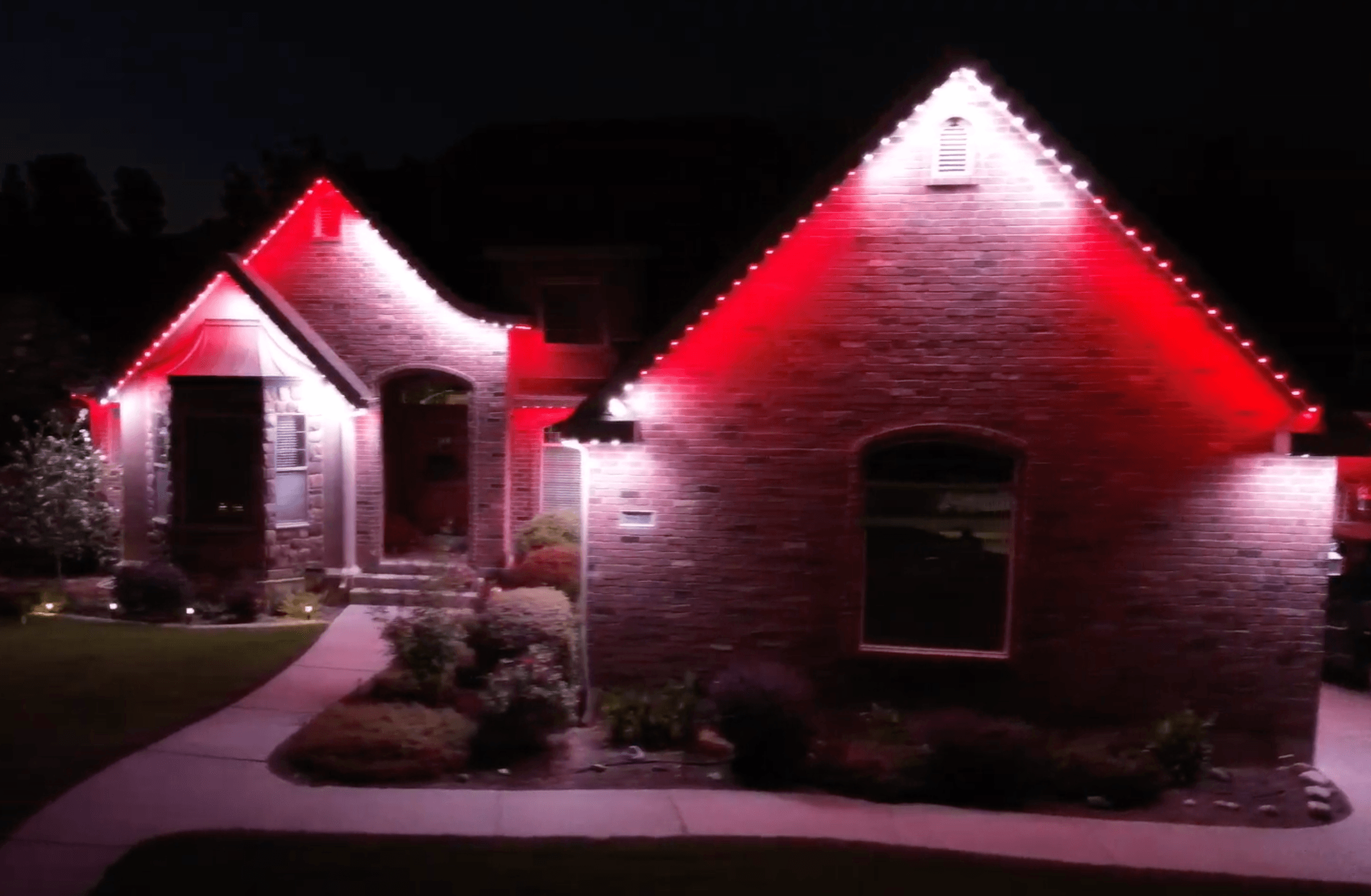 Music sync lighting display on a home during the holidays