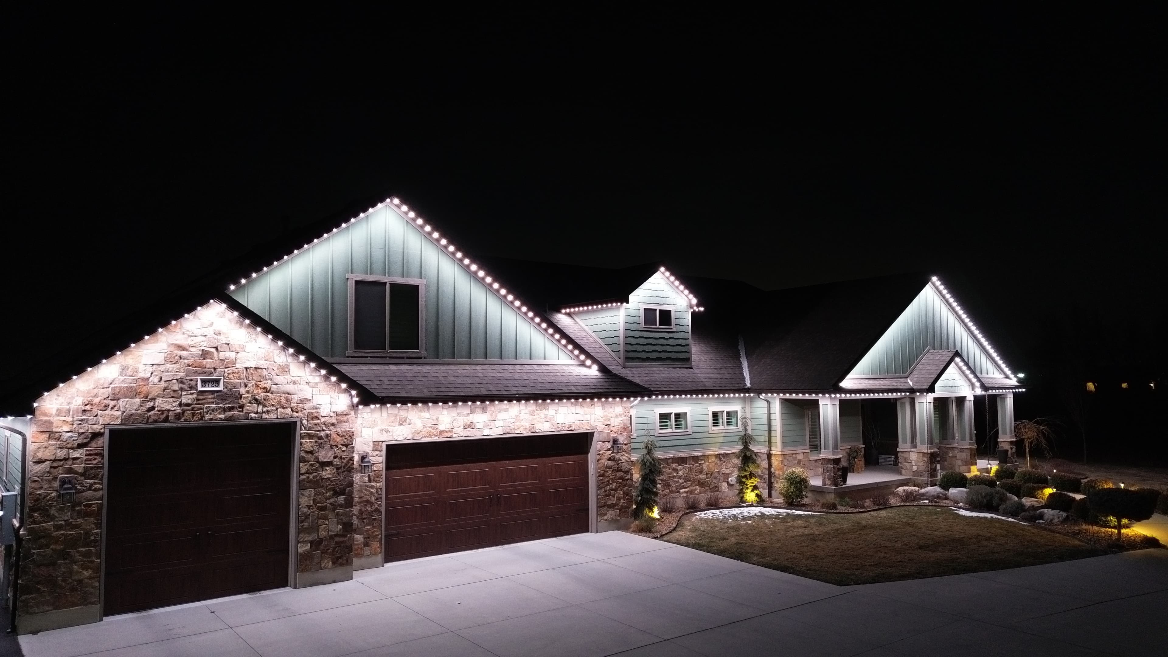 Security lighting illuminating a home at night